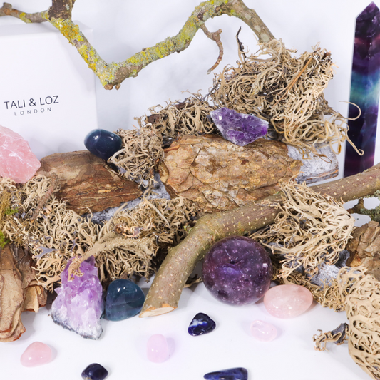 Amethyst, fluorite and rose quartz on wooden items