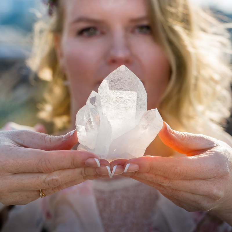 Laura holding clear quartz cluster