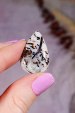 Astrophyllite Cabochon | Teardrop | Russia Cabochon Piece A (small) - Weight: 5.14g | Size: 3.0 × 1.9 × 0.6 cm Tali & Loz Crystals